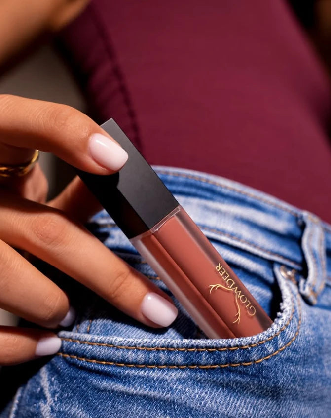 GlowDeer lip gloss slipped into a jeans pocket